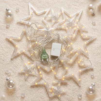 White star-shaped LED string light set by Wukusy, warm fairy lights for decorative use, shown draped across a surface.